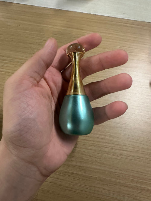 Sehr attar bottle — teal metallic teardrop with gold wire neck