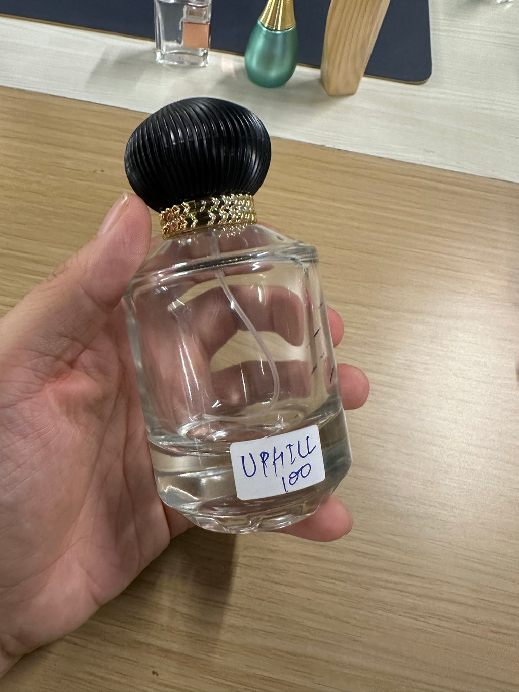 Shab EDP bottle — clear octagonal glass with black ribbed dome cap